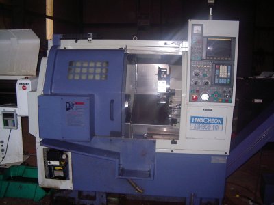 Fanuc CNC Control, 15" Swing, 6" Chuck, 8.6" Max Turning Diameter, Tailstock w/15.7" Centers, 2" Bar Capacity, 6000 RPM, Magazine Bar Feeder, New 1999