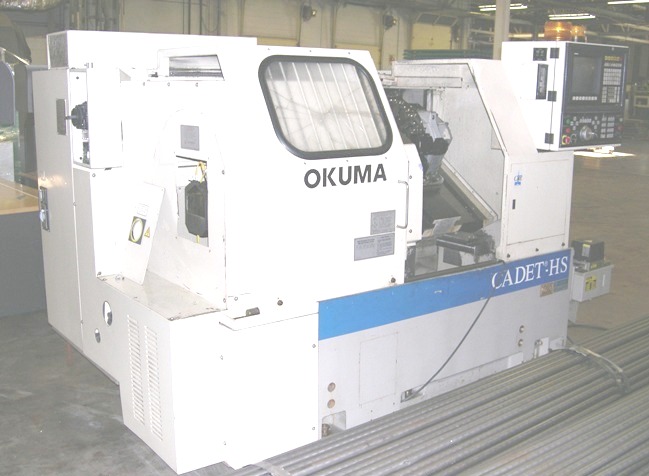 Okuma OSP 5020L CNC w/Graphics,  IGF, 15" Swing, 6" Chuck, 10 HP, 1.63" Bar Capacity, 7000 RPM, Chip Conveyor,  Manual Tool Setter,Collet Chuck, New 1995