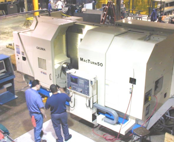 Okuma MacTurn 50 OSP 7000L CNC, 28.34" Turning Capacity, Tailstock w/ 69" Centers, 30 HP Universal Milling/Turning Head, 12 Position Lower Turret, 72 Station Tool Changer, Full C-Axis, 1 Degree Indexing B-Axis, 9.84" Y-Axis, Cat-50, High Pressure Thur Tool Coolant, New 2000